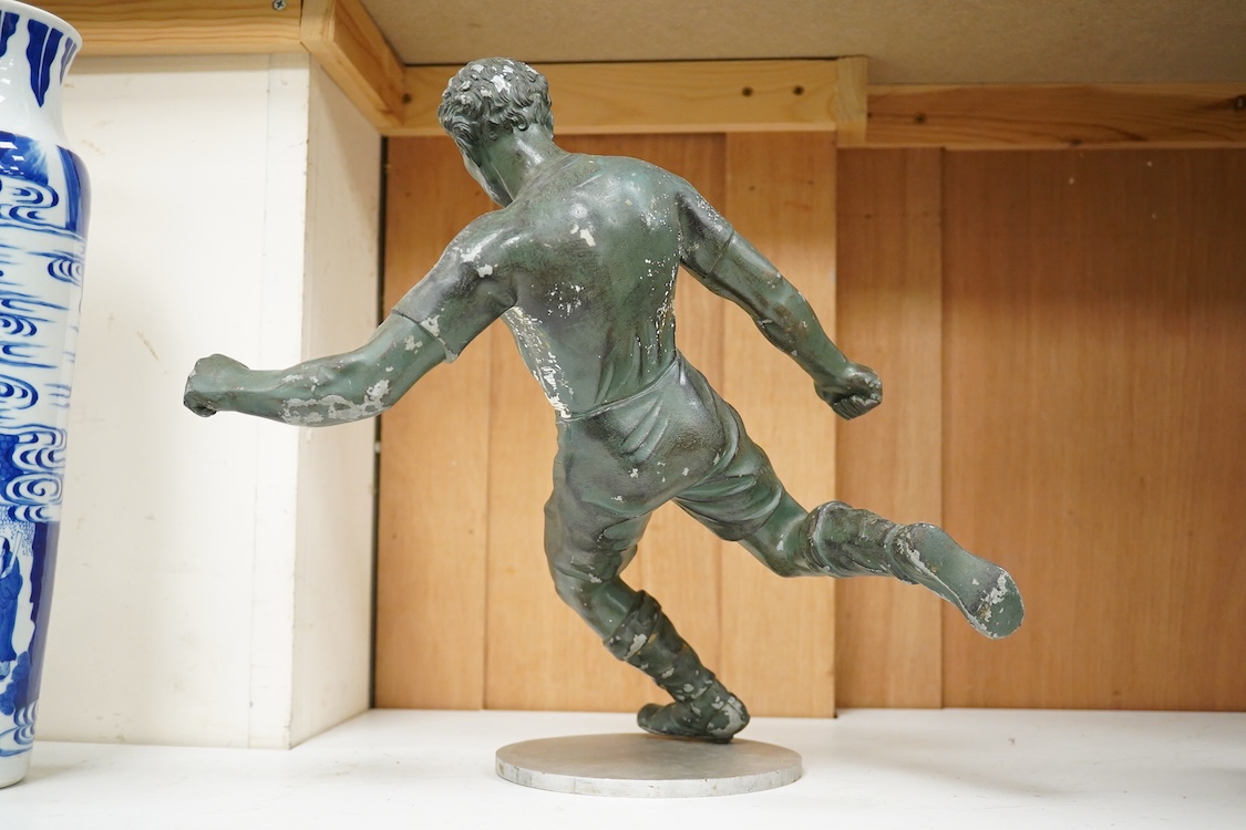 A mid 20th century aluminium cast sculpture of a footballer on stand- 35.5cm wide